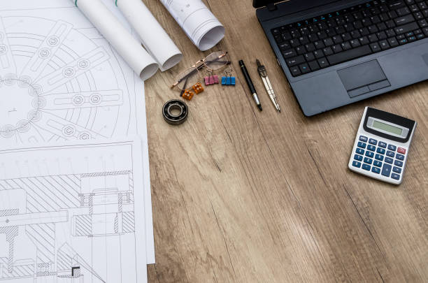 istock Engineer's workplace with different details on wooden table 1134081304