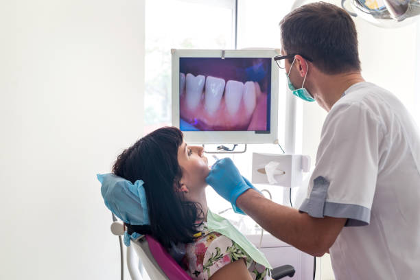 istock Dentist examining patient's teeth with intraoral camera 1134081715