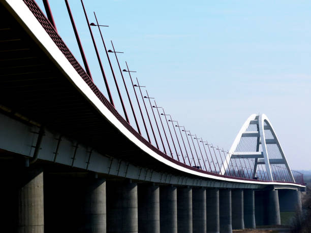 istock elegant white steel arched bridge with tilted street lights 1134083326