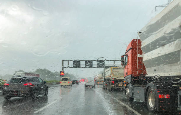 heavy rain on german autobahn heavy rain on german autobahn, mobile phone shot truck in rain stock pictures, royalty-free photos & images