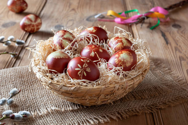 istock Easter eggs dyed with onion peels with a pattern of fresh herbs 1134085337