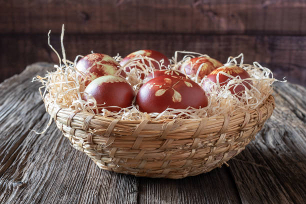 istock Easter eggs dyed with onion peels with a pattern of fresh herbs 1134085348