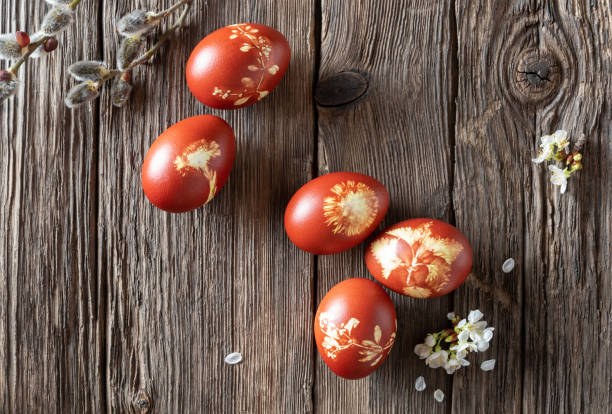 istock Easter eggs dyed with onion peels with a pattern of fresh herbs 1134085350