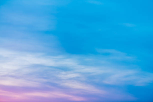 istock Sunset sky with pink lilac light clouds. Colorful smooth blue white sky gradient. Natural sunrise background. Amazing heaven at morning. Slightly cloudy evening atmosphere. Wonderful weather on dawn. 1134085880