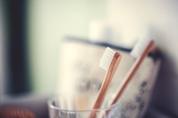 istock Two eco-friendly wooden toothbrushes in the glass 1134087348