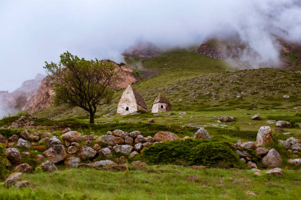 istock fog and low clouds in the mountains among the ancient settlement at sunset 1134087650