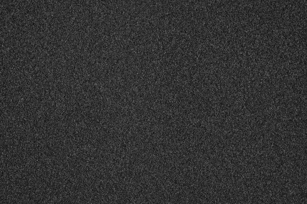 istock Dark black background image, texture.Textured background. Decorative plaster walls, external decoration of facade. Texture of beige. 1134089504