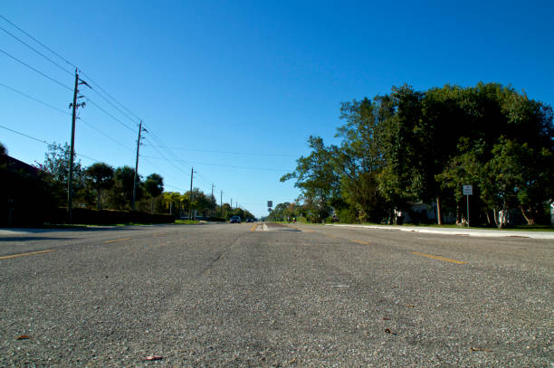 istock low angle view of wide open road and clear sky 1134089665