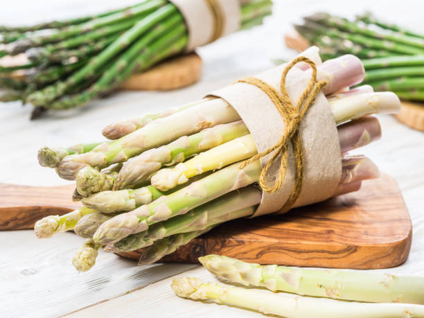 istock Bundles of green and white asparagus. 1134090653