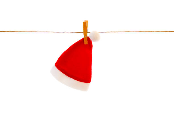 Hat from the soft man Christmas hat on clothesline; christmas preparation mütze stock pictures, royalty-free photos & images