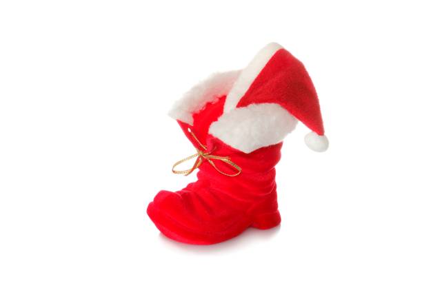 Boots from Santa Santa Claus boots on the ground mütze stock pictures, royalty-free photos & images