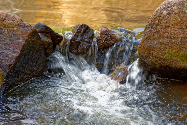Small creek with clear waters running through the rocks of the mountains of Minas Gerais