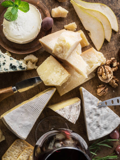 istock Cheese platter with organic cheeses, fruits, nuts and wine. 1134093623