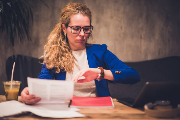 Young beautiful female chasing time. Businesswoman working in cafeteria. time management student stock pictures, royalty-free photos & images