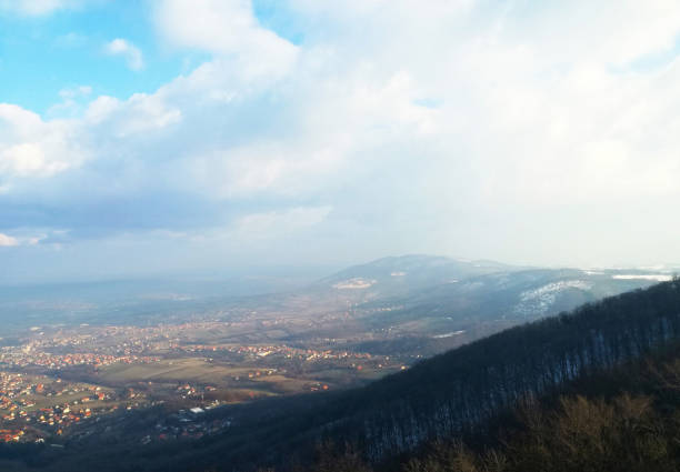 Panoramic view from the mountain with sunny blue sky and mountains, beautiful nature
