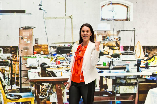 Female seamstress standing at her work space