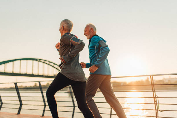 istock Senior couple jogging together 1134098303