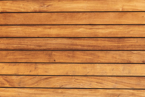 The texture of the pine boards. Horizontal wooden fence.