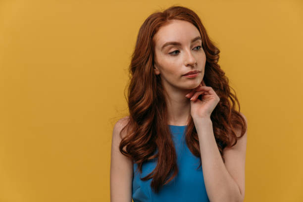 istock Woman model with ginger hair posing indoors 1134101055