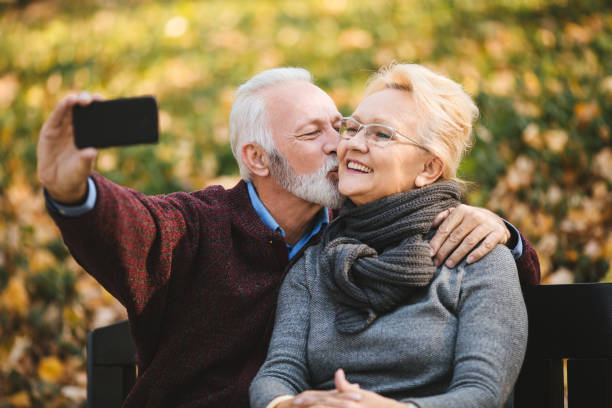 istock Senior couple taking Selfie in the park 1134101131