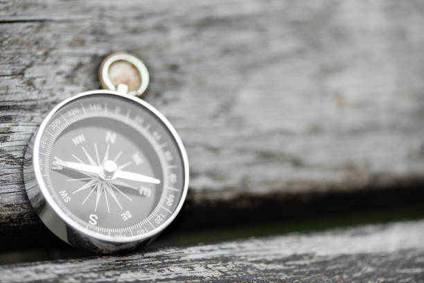 istock Compass on a beautiful wooden surface. Top view 1134101297