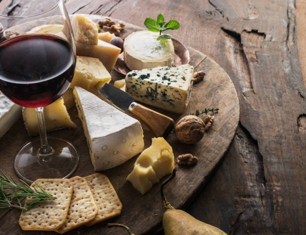 istock Cheese platter with organic cheeses, fruits, nuts and wine. 1134101662