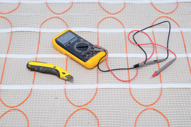 Installation tools on heating cable for warm floor close-up.