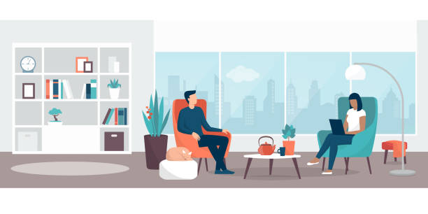 Couple relaxing at home in the living room Couple relaxing at home sitting on the armchairs  in the living room, the woman is connecting with her laptop, lifestyle and interior design concept living room stock illustrations
