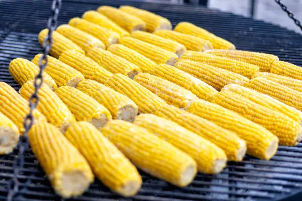 Photo of grilled corn at street festival. street vegetarian food.healthy eat.