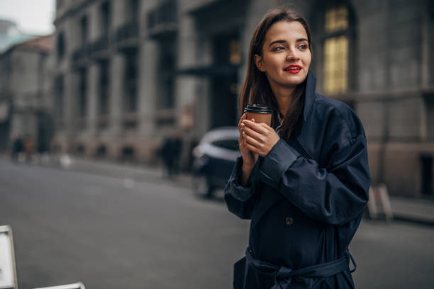 istock Charming woman is drinking coffee 1134102625