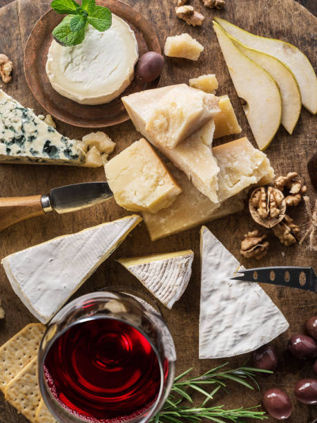 istock Cheese platter with organic cheeses, fruits, nuts and wine. 1134103380