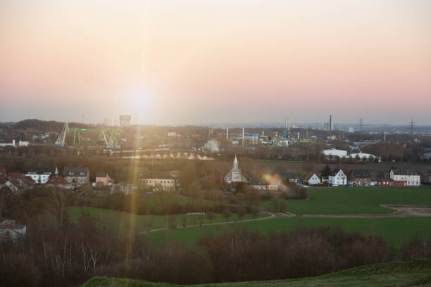 Dortmund in North Rhine Westphalia, Germany, here a northern quarter, with settlement, canal and industry, a park formed on a formerly coal heap in the forground