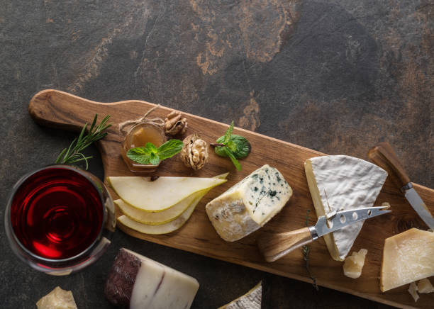 istock Cheese platter with organic cheeses, fruits, nuts and wine. 1134106049