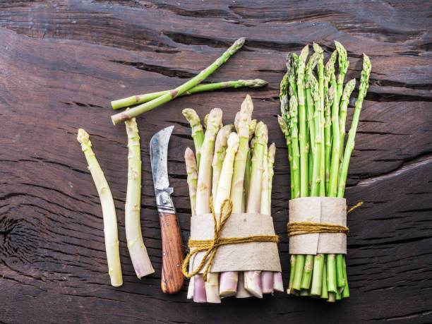 istock Green and white types of asparagus sprouts. 1134106165