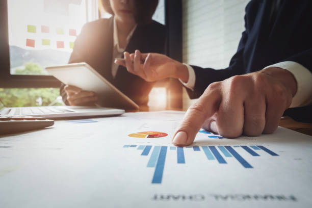 istock Economic research discussions, Business team analyzing income charts and graphs to plan marketing concept with using tablet and calculator  for analysis. 1134110316