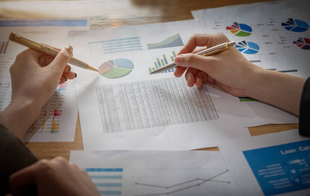 istock Economic research discussions, Business team analyzing income charts and graphs to plan marketing concept with using pen and calculator  for analysis. 1134110343