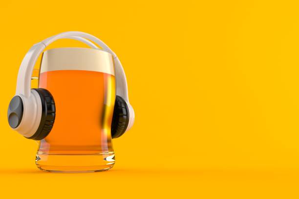 Glass of beer with headphones stock photo