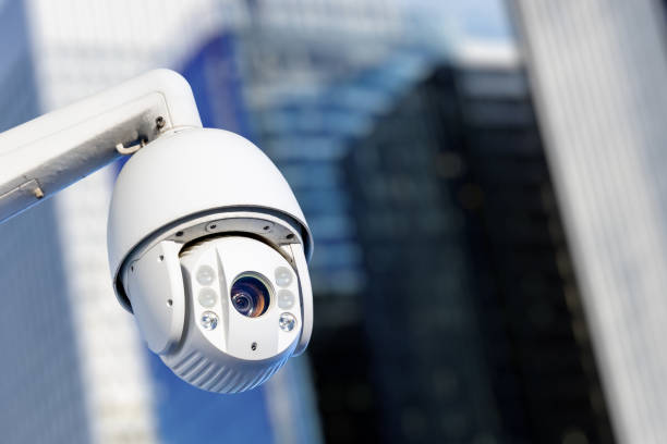 istock Modern CCTV camera with business buildings in the background 1134115505
