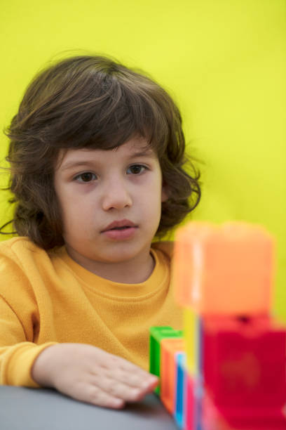 Happy child playing with Preschoolers Building Blocks