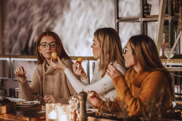 istock Women tasting delicious pastry 1134123403