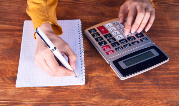 istock businesswoman, calculator documents 1134124099