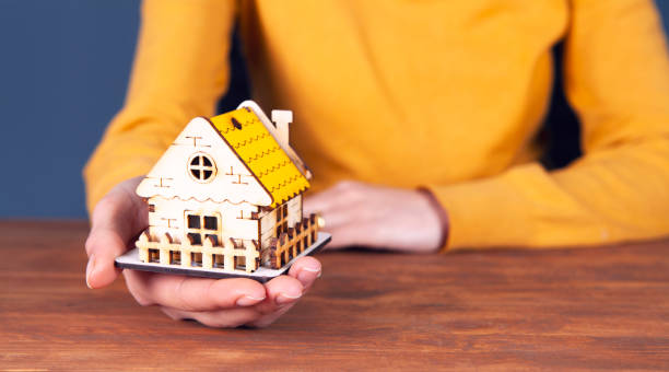 istock businesswoman and house 1134124123
