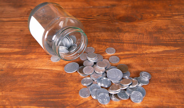 istock glass jar and coins 1134124128