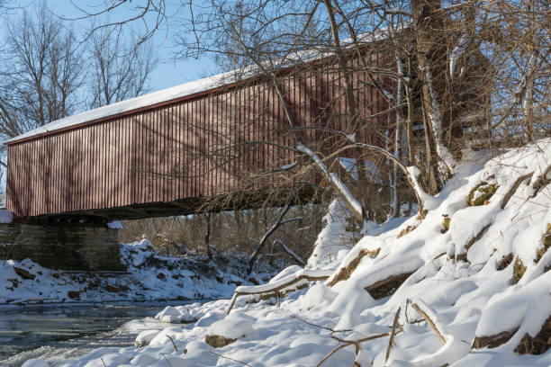 istock historical red covered bridge on a snowy sub zero winters day. 1134127941