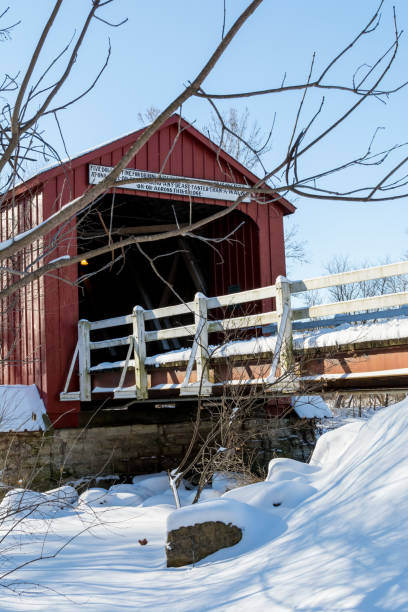 istock historical red covered bridge on a snowy sub zero winters day. 1134127952