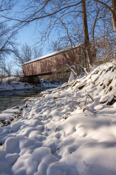 istock historical red covered bridge on a snowy sub zero winters day. 1134127979
