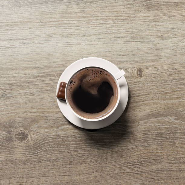 istock Coffee cup with chocolate on woody background 1134130387