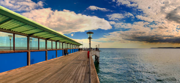 Boscombe pier near Bournemouth, Dorset Concrete and wood pier at Boscombe near Bournemouth, Dorset boscombe photos stock pictures, royalty-free photos & images