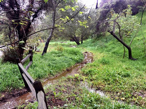istock Flowing Stream with wood corral fence 1134138578