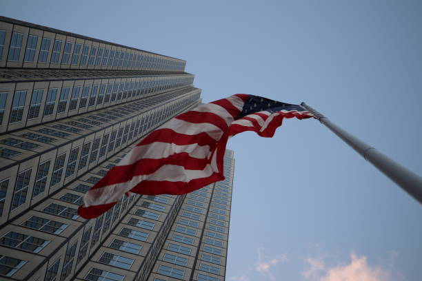 istock American flag fluttering in the wind against a skyscraper 1134139837